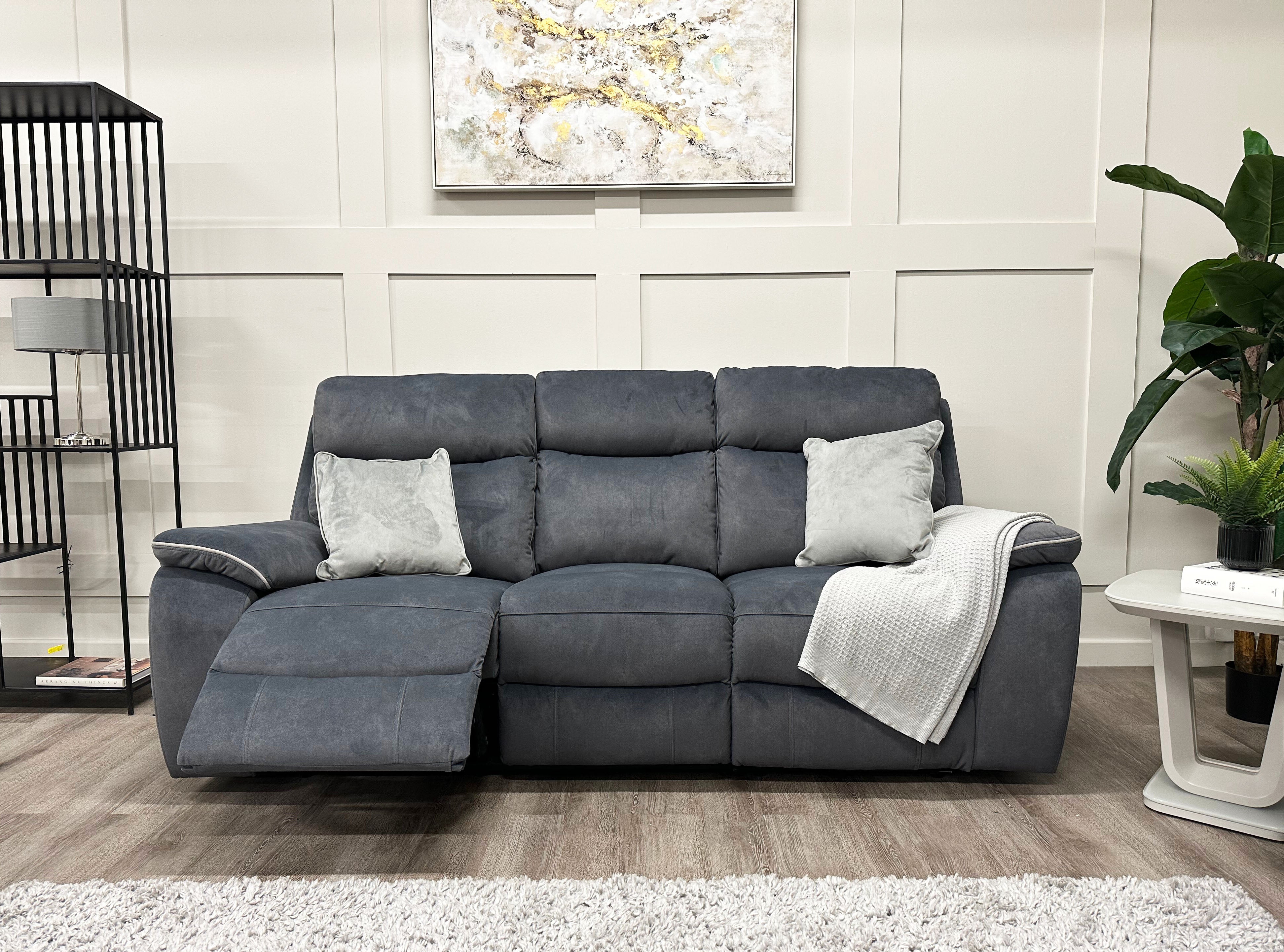 Image of the Naples 3 Seater Recliner Sofa in its reclined position styled with cushions