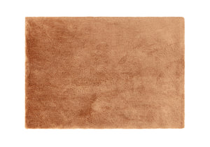 A terracotta rug on white background. 