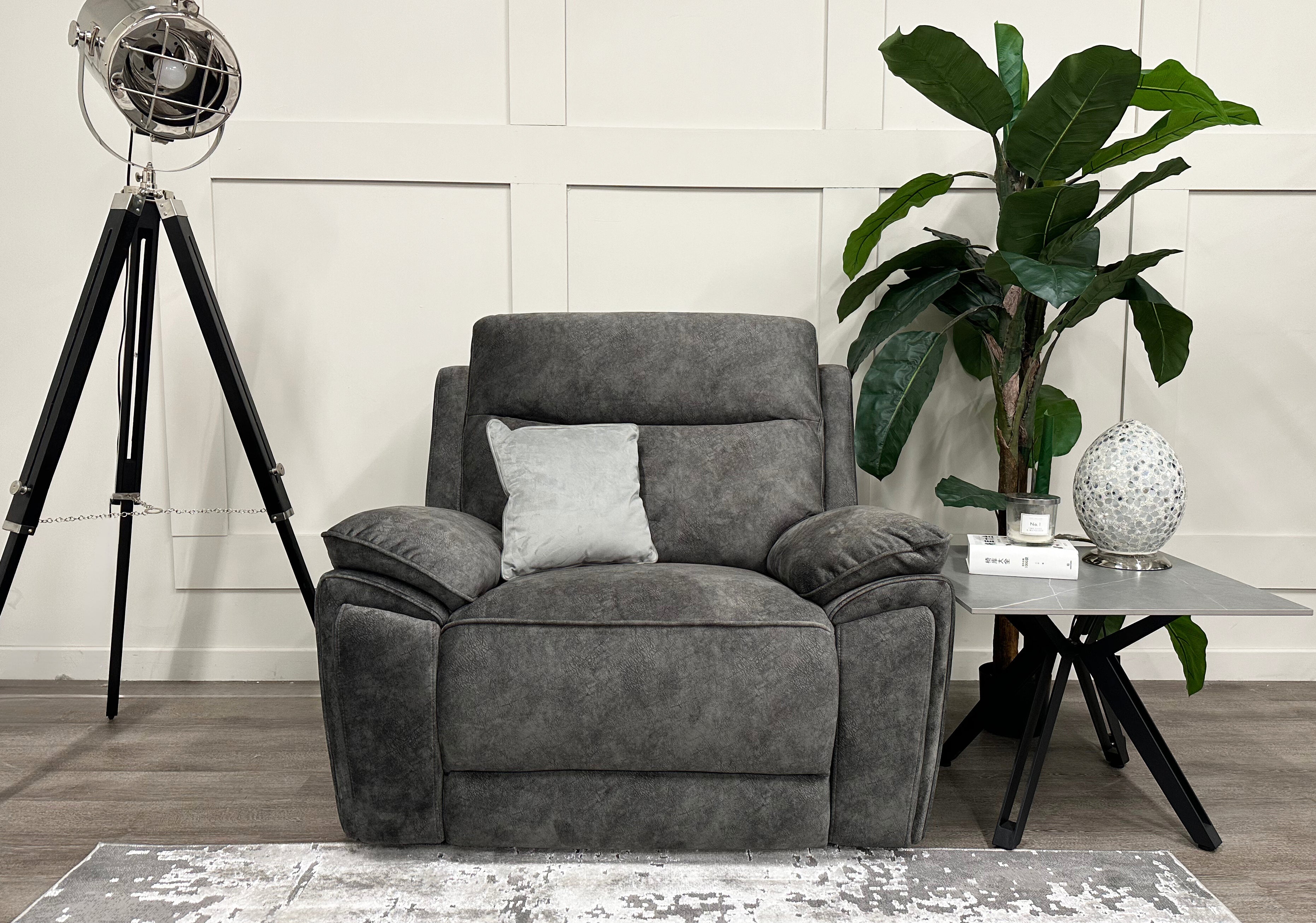 Front view of the grey Osaka Love Chair Power Recliner in a room styled with a cushion