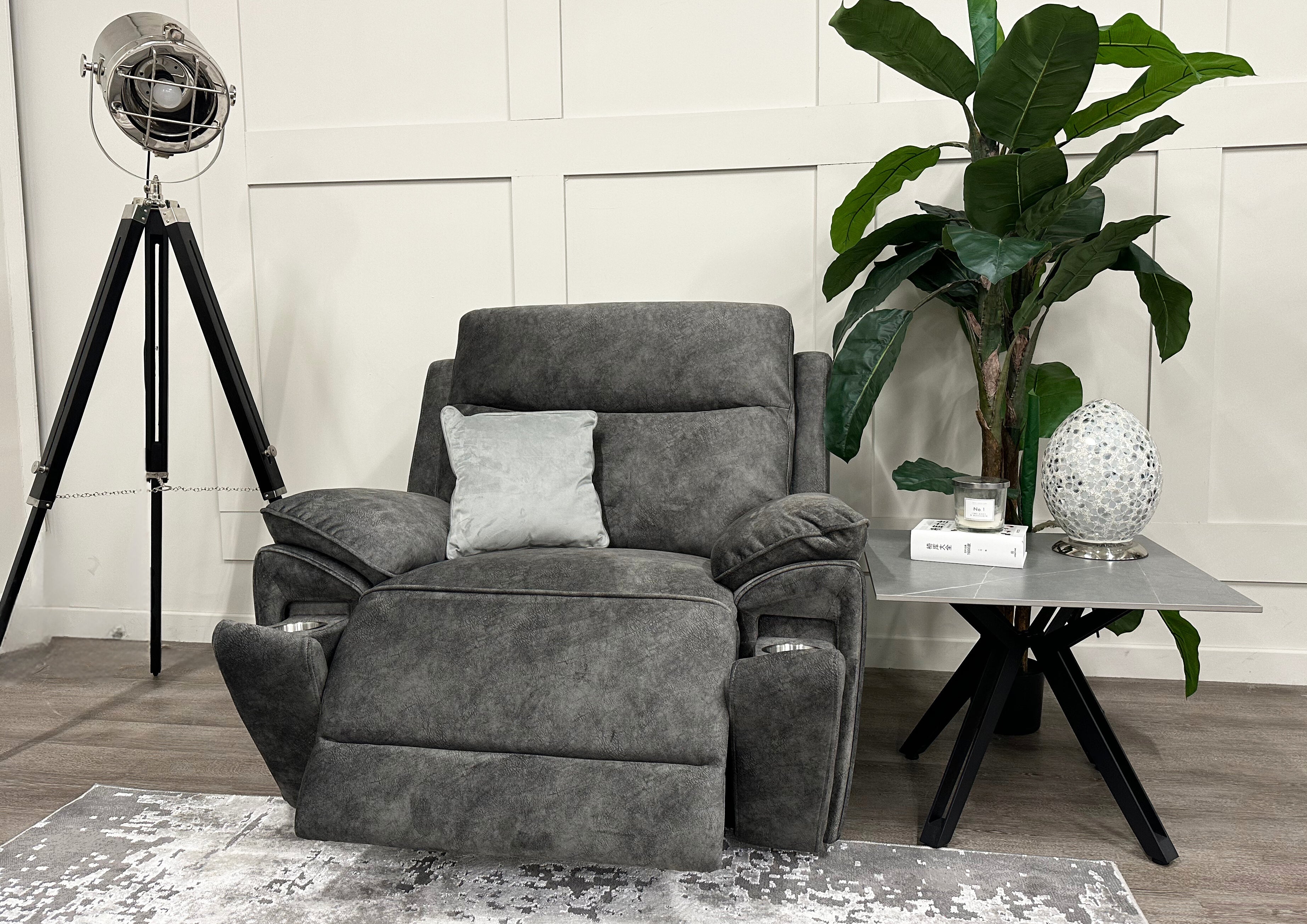 Angled view of the grey Osaka Love Chair Power Recliner in a reclined position with its cupholders