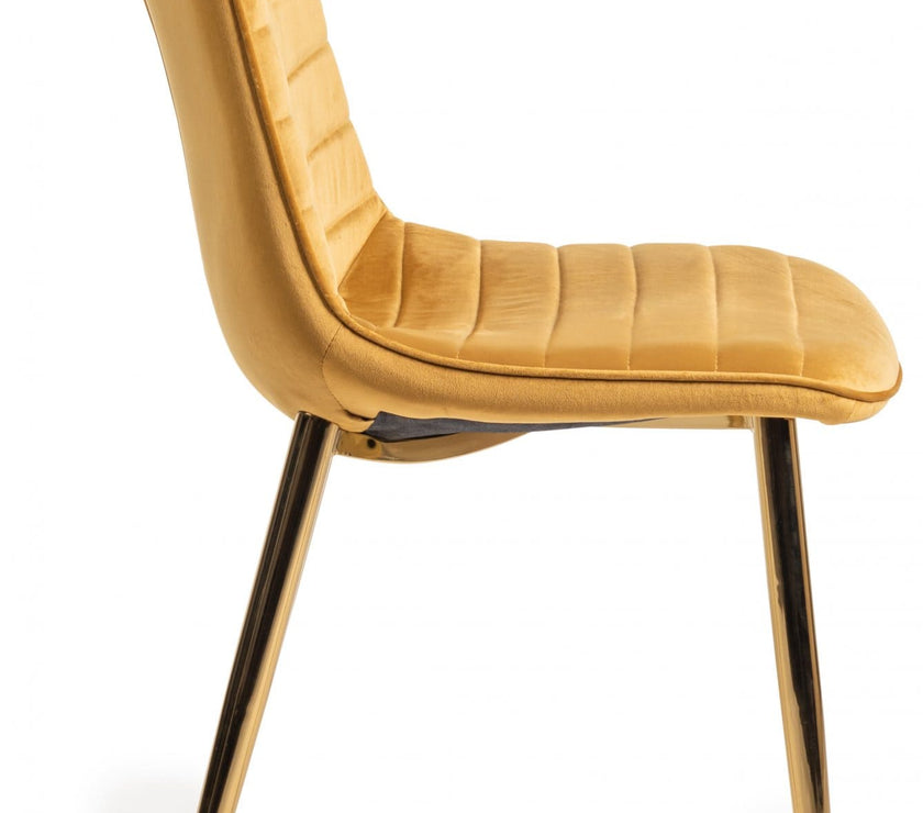 Side image of the Aso Velvet Dining Chairs with tapered back, light-reflecting velvet, and golden tapered legs.