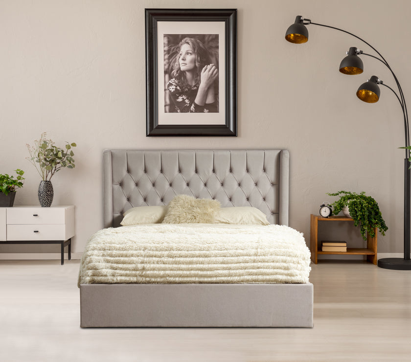 Front view of the Faro Ottoman Bed Frame in a room