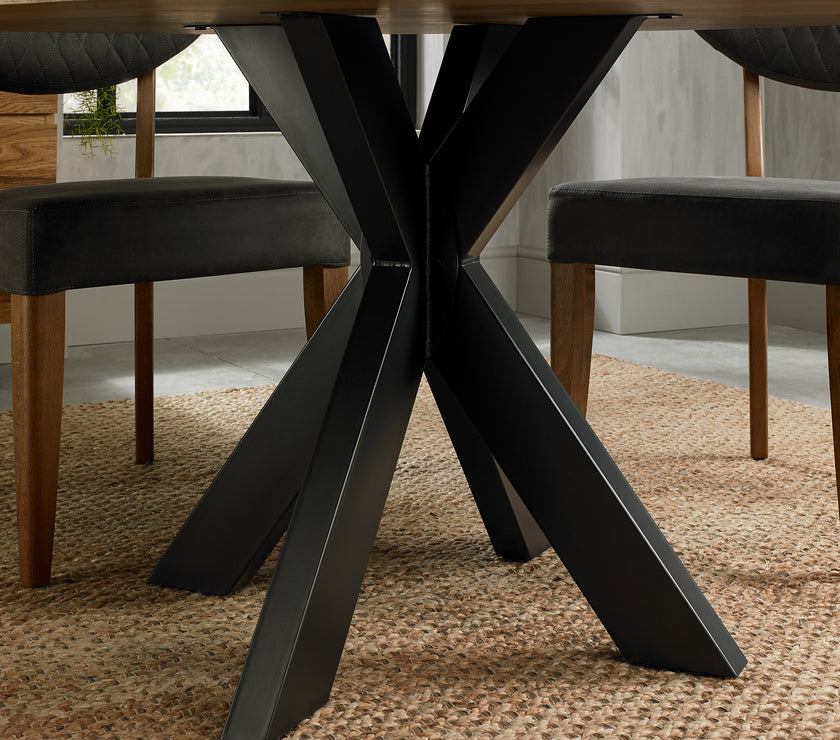 Image of the legs of the Elliot Rustic Oak Round Dining Table