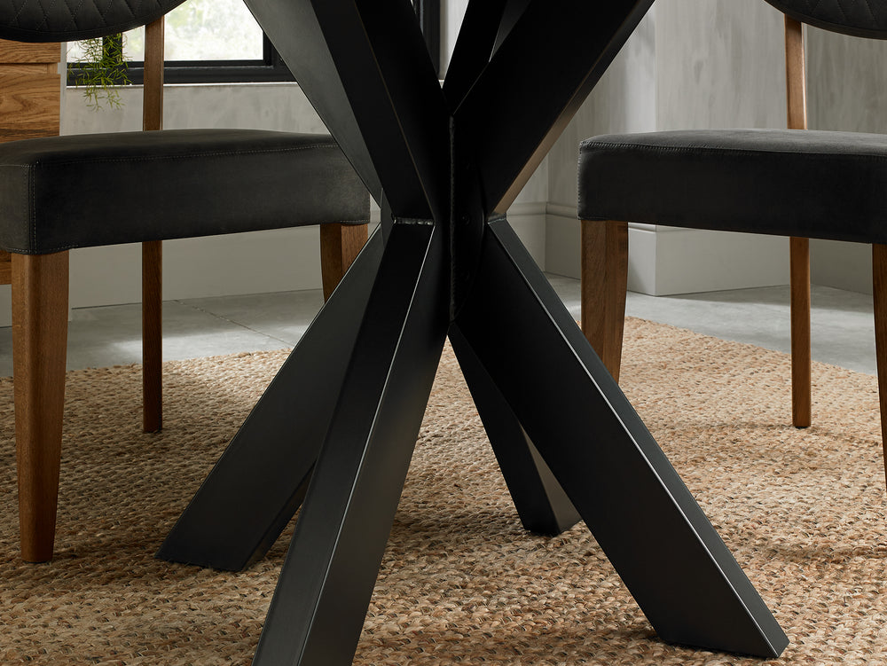 Image of the legs of the Elliot Rustic Oak Round Dining Table