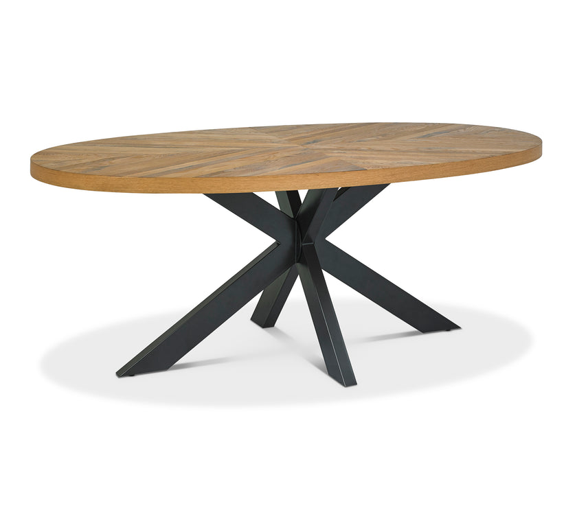 Angled view of the Elliot Rustic Oak Oval Dining Table.