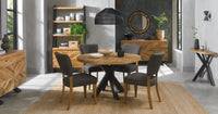 Image of the Elliot Rustic Oak Round Dining Table being styled with NCF's Dining Furniture.