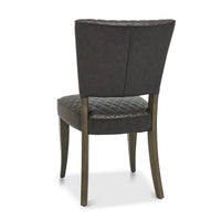 Back and angled Image of the Landon Fumed Oak Dining Chairs Saddle Faux Leather with dark oak frame styled with NCF's Dining Furniture.
