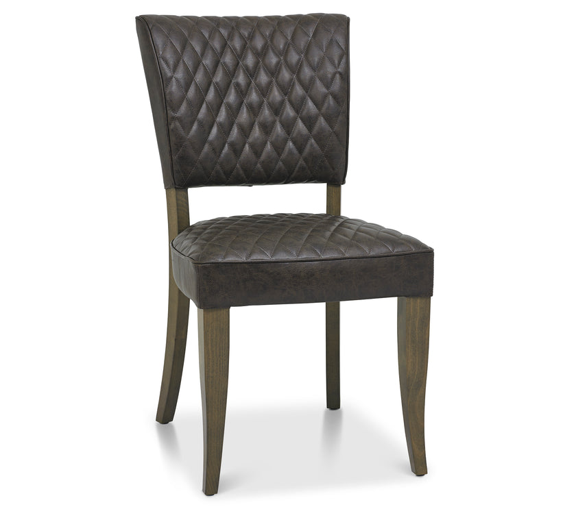 Angled and front Image of the Landon Fumed Oak Dining Chairs Saddle Faux Leather with dark oak frame styled with NCF's Dining Furniture.
