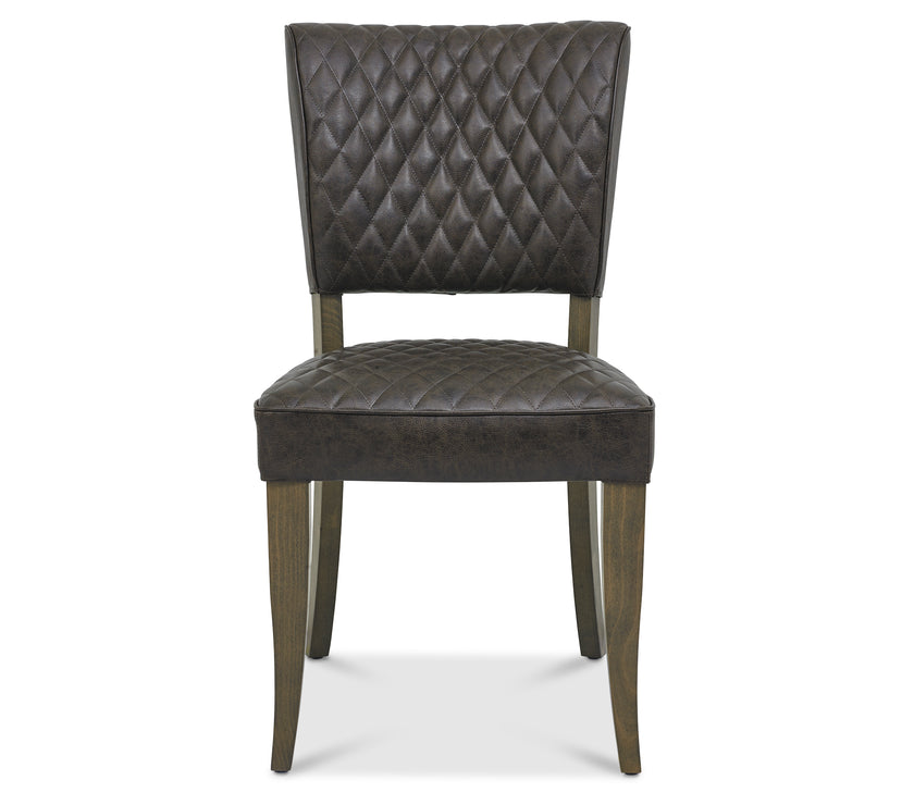 Front Image of the Landon Fumed Oak Dining Chairs Saddle Faux Leather with dark oak frame styled with NCF's Dining Furniture.
