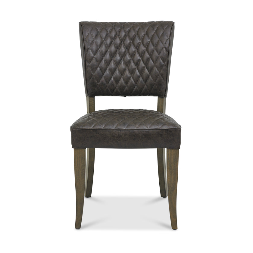 Front Image of the Landon Fumed Oak Dining Chairs Saddle Faux Leather with dark oak frame styled with NCF's Dining Furniture.
