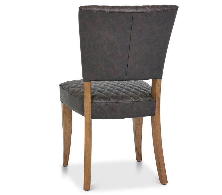 Back and angled image of the Landon Rustic Oak Dining Chairs with lightly oiled oak frame and saddle brown faux leather seat.