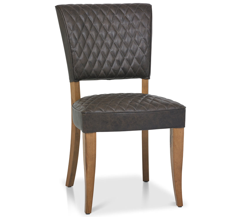 Angled and front image of the Landon Rustic Oak Dining Chairs with lightly oiled oak frame and saddle brown faux leather seat.