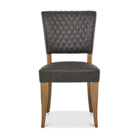 Front image of the Landon Rustic Oak Dining Chairs with lightly oiled oak frame and saddle brown faux leather seat.