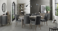 Image of the Marilyn Fabric Dining Chairs with slate grey upholstery and silver grey tapered legs styled with the rest of NCF's Dining Furniture.