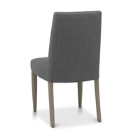 Back and angled view of the Marilyn Fabric Dining Chairs with slate grey upholstery and silver grey tapered legs.