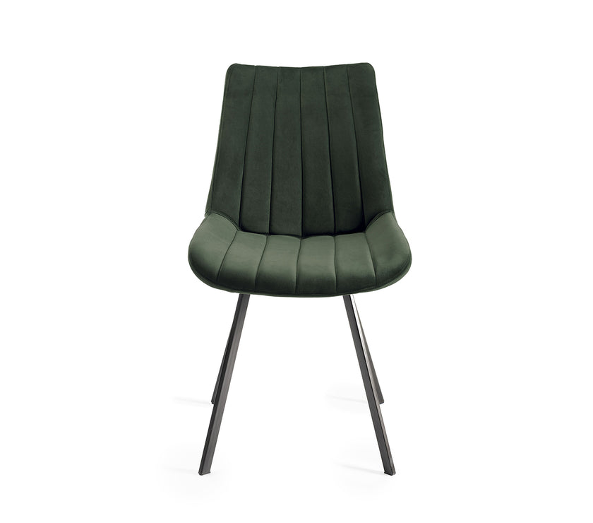 Front image of the Savio Dining Chairs in green velvet with vertical stitching and metal legs.