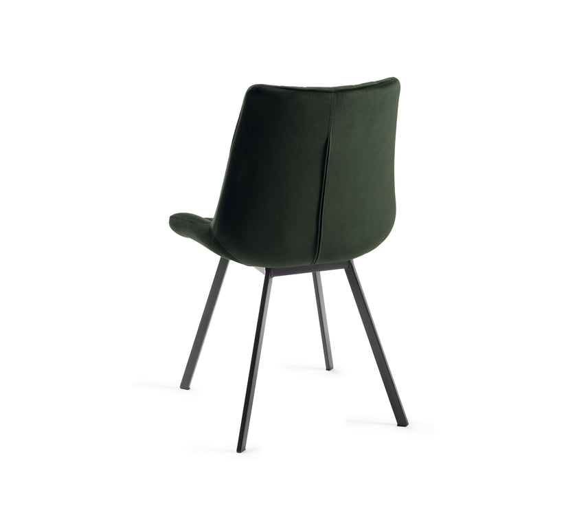 Angled and back view of the Savio Dining Chairs in green velvet with vertical stitching and metal legs.