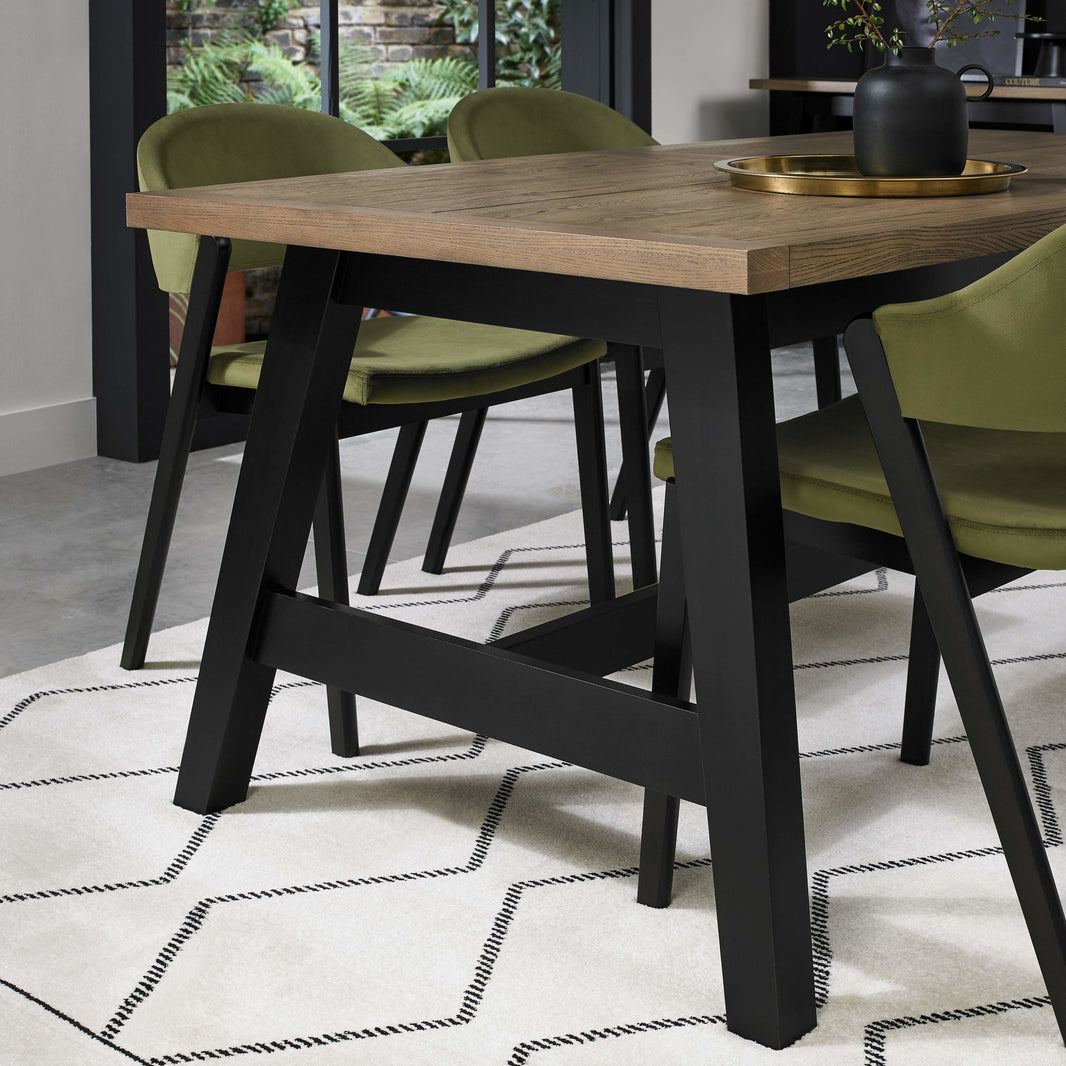 Image of the Candice 6-8 Seater Extendable Dining Table styled with some dining furniture
