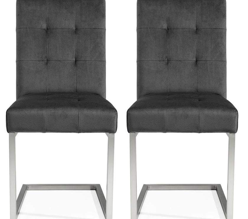 Front view of the Toulouse Velvet Dining Chairs with gunmetal fabric, chrome cantilever frame, and quilted button detailing.