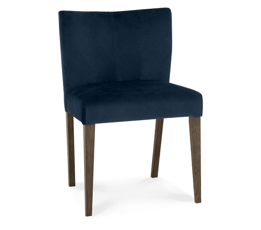 Front, angled and close up view of the Turner Dark Oak Dining Chairs with foam cushion, fabric upholstery, and tapered dark oak legs